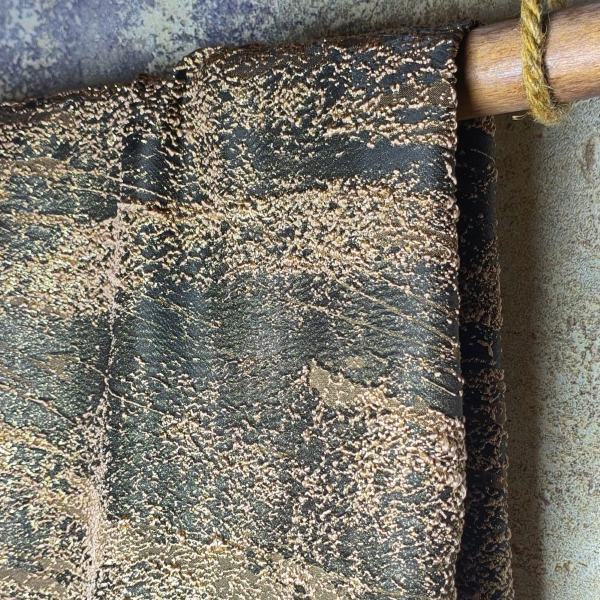 Colored heavy-duty designer fabric with golden thread luster and solid particles