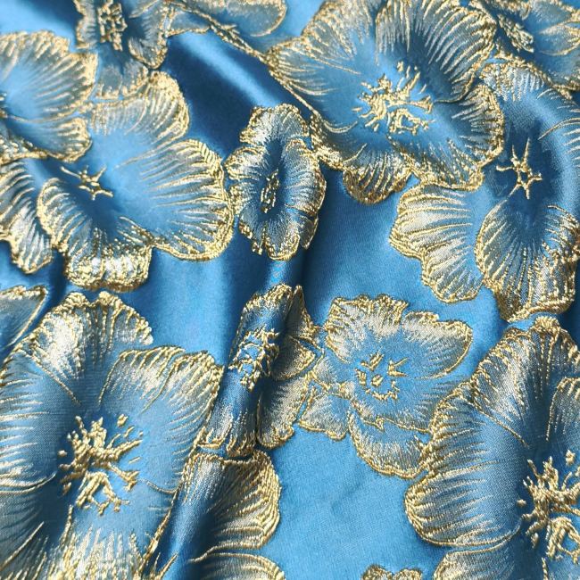 Light blue petal solid relief gold thread designer fabric