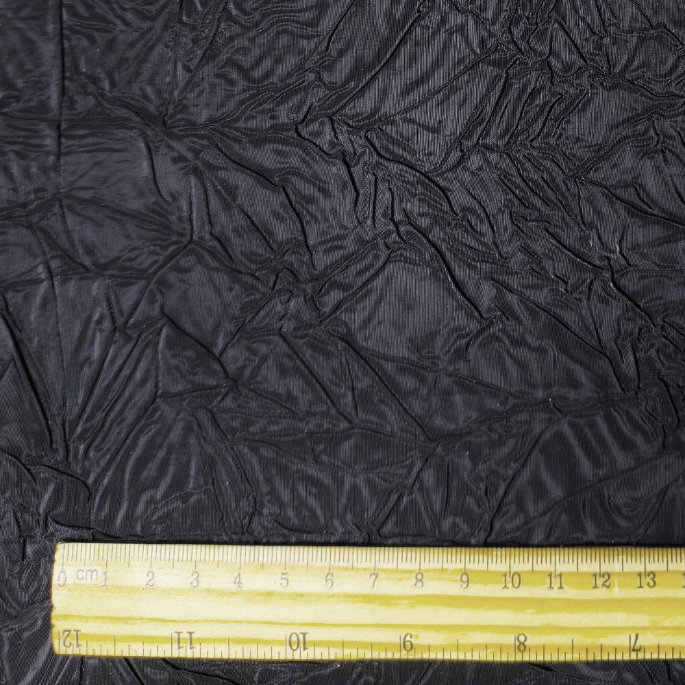 Black irregularly pleated texture embossed fabric