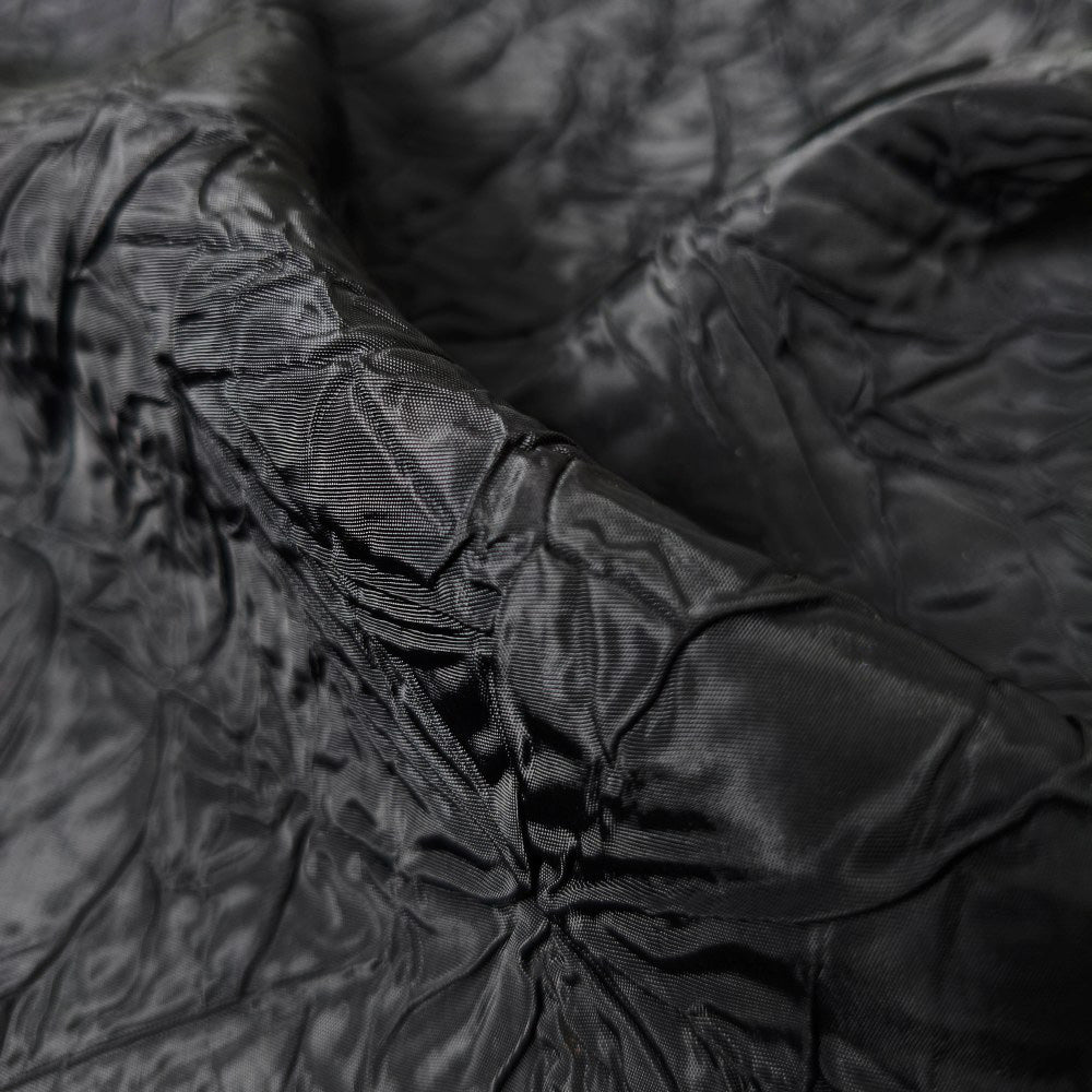 Black irregularly pleated texture embossed fabric