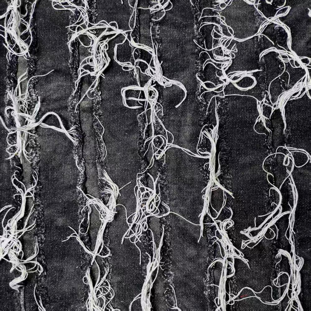 Black washed tie-dye denim fabric with horizontal stripes and fringed edges