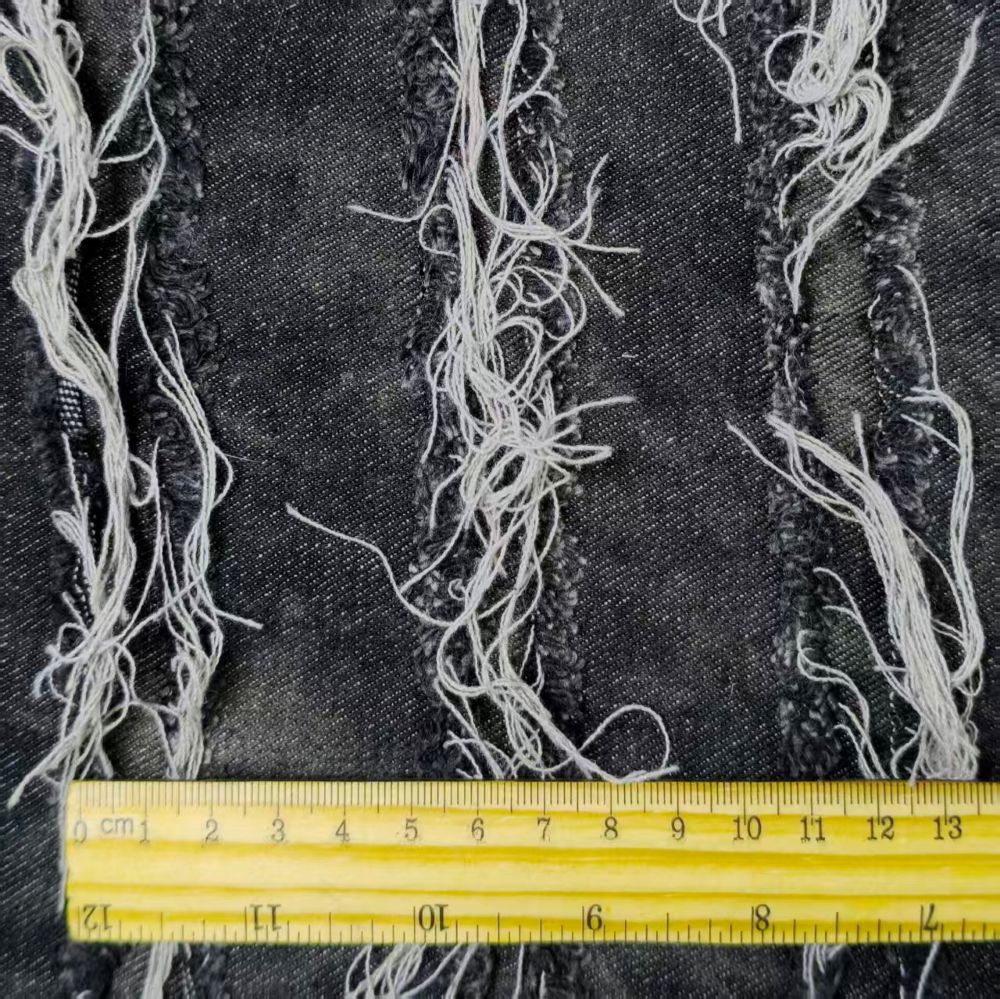 Black washed tie-dye denim fabric with horizontal stripes and fringed edges