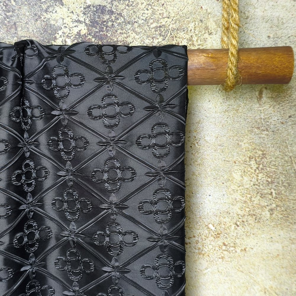 Black geometric embossed heart lock texture fabric