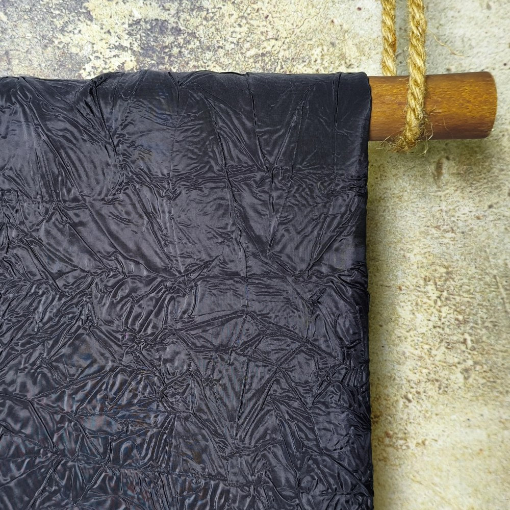 Black irregularly pleated texture embossed fabric